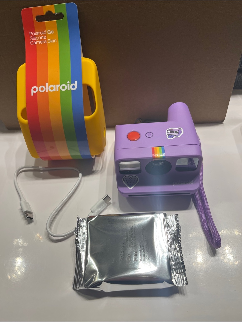 NWOT Polaroid Lilac Instant Camera Go with Yellow Silicone Skin